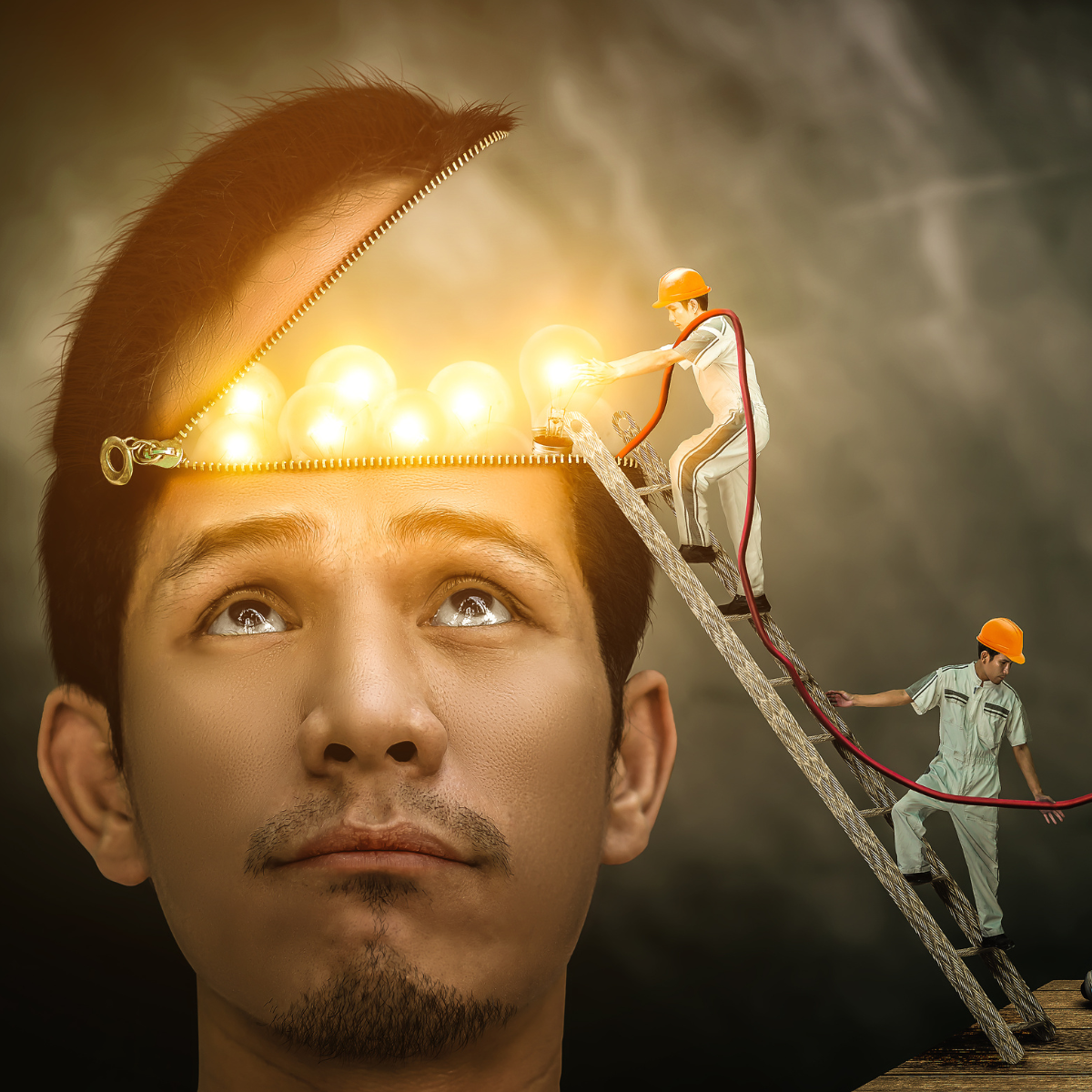 graphic image of man with the top of his head open and little workers turning on lights and adding power - impact of strength training on executive function